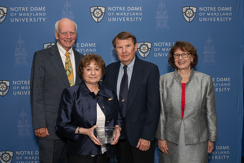 Grace Solimando Zaczek with her husband, guest, and President Yam