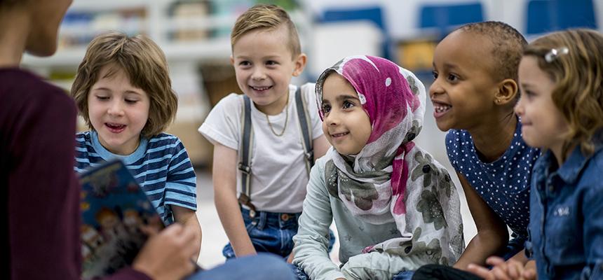 group of young students being read to 